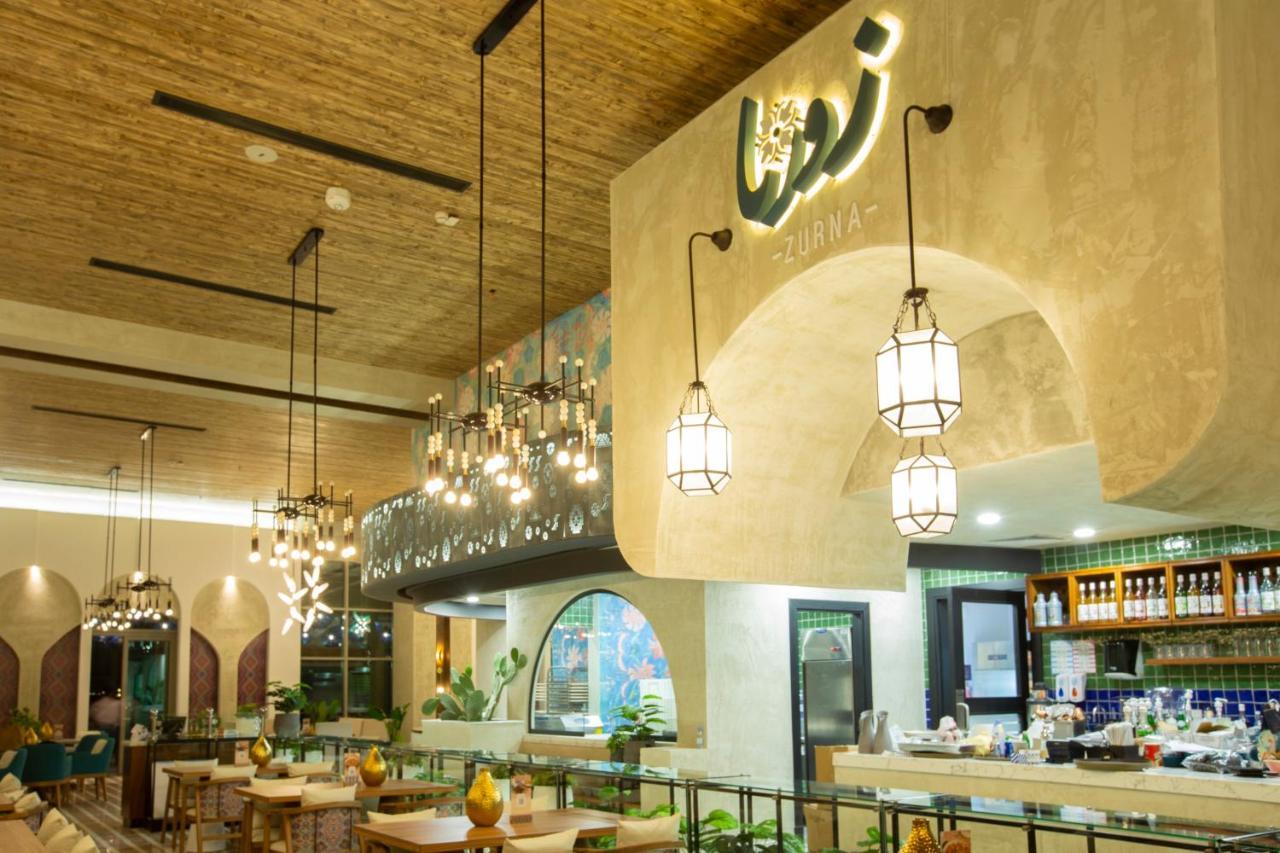 Citadines Abha Aparthotel ภายนอก รูปภาพ Interior of the restaurant