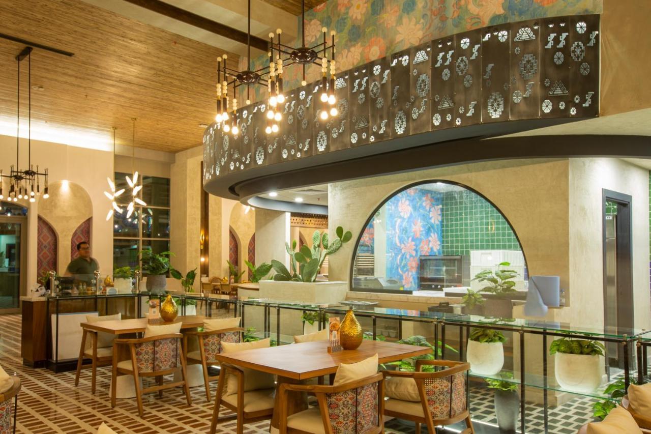 Citadines Abha Aparthotel ภายนอก รูปภาพ The interior of the restaurant